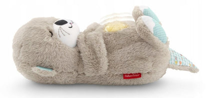 Pluszowa wydra Fisher-Price Soothe ’n Snuggle leżąca na plecach, widok z boku na jasnym tle.
