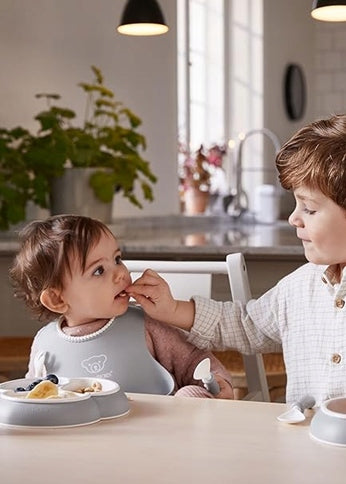 BABYBJORN silikónové podbradníky s vreckom x2