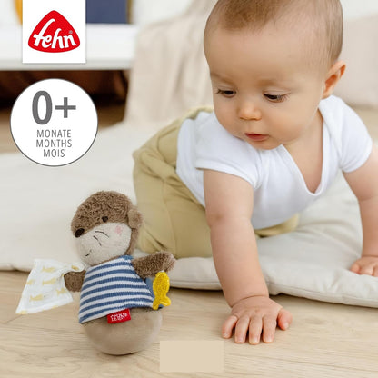 FEHN bábika na pružine VYDRA, neprevrátiteľná hračka s hrkálkou, 15 cm
